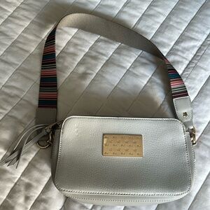 Grey crossbody bag with striped strap